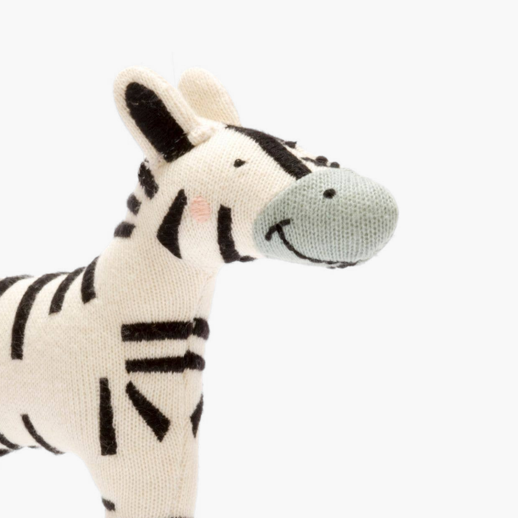Plush zebra toy on a white background